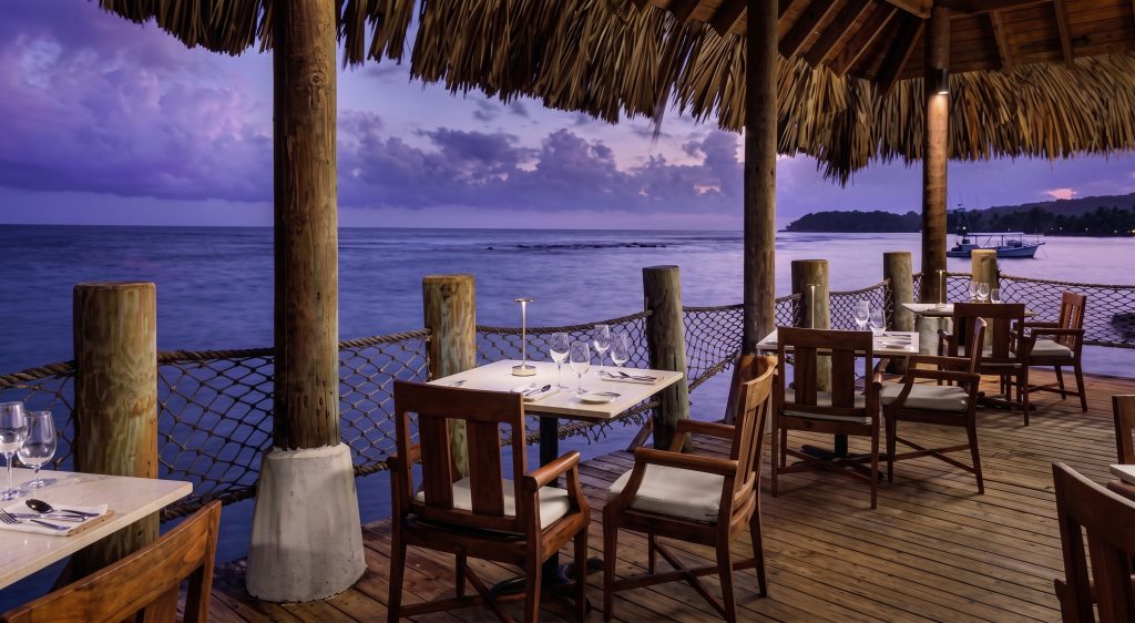 Seaside Thatched Cliff Dining at Sunset
