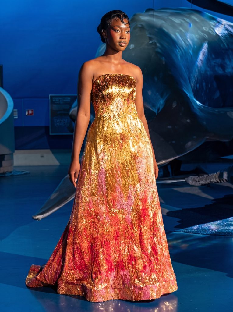 Model in Gold and Red Sequin Evening Gown