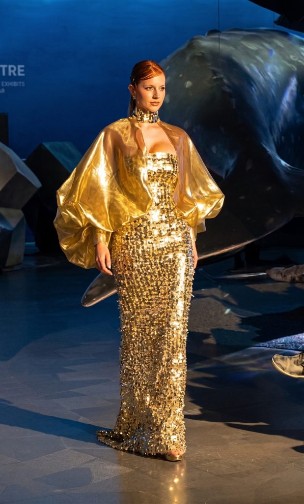 Model in Gold Cape Evening Gown